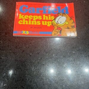 Comic book Garfield. Keeps his chins up. His 23rd book. By Jim Davis
